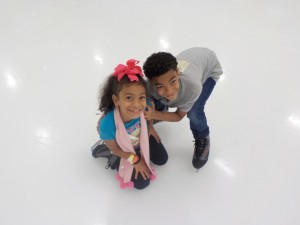 Siblings ice skating