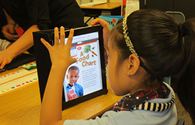 This image of a student using an iPad will link to the Technology department page.